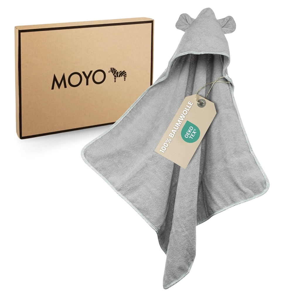 Das graue MOYO Kapuzenhandtuch in der stylischen Geschenkbox – das perfekte Unisex-Geschenk zur Geburt.
