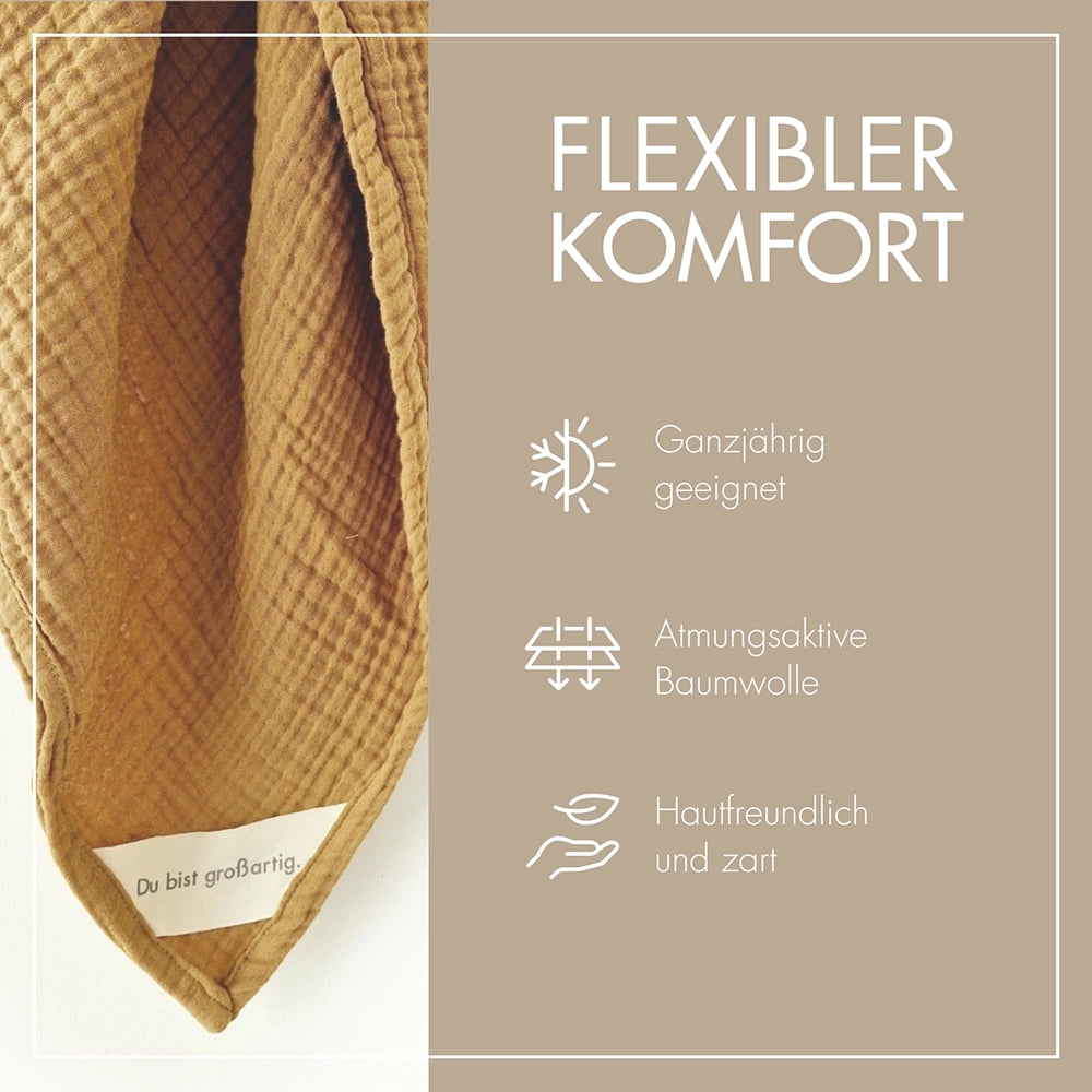 Detailansicht der weichen Struktur der 4-lagigen Musselin Decke in Ocker – atmungsaktiv und sanft.